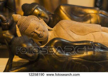 Stock Image - Buddha's shop in Luh Market; Siem Reap, Cambodia. Fotosearch