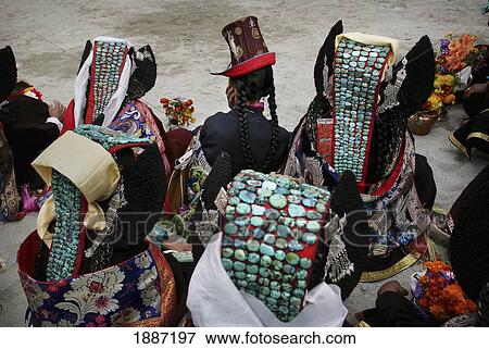 Stock Photo - Buddhist Ladakhi Women Wearing Traditional Dress And Hats With Long Platted Hair And Head Dress With Turquoise Stones. Fotosearch
