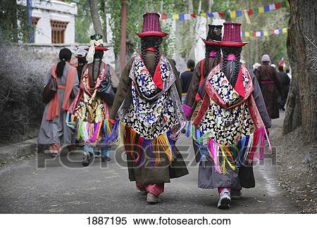 Stock Photography - Buddhist Ladakhi Women Wearing Traditional Dress And Hats With Long Platted Hair. Fotosearch