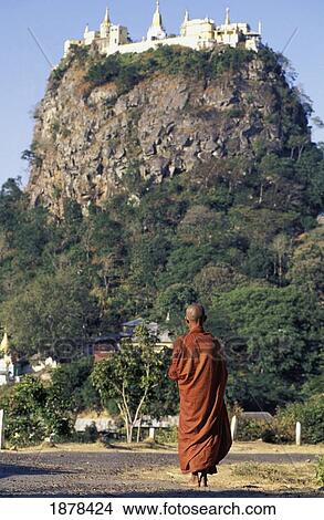 Picture - Buddhist Monk And Pagoda On Mount Popa. Fotosearch