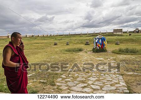 Buddhist monk on a mobile phone by the Larviran Temple at the Erdene Zuu Monastery, Karakorum (Kharkhorin),? v÷rkhangai Province, Mongolia View Large Photo Image Stock Image - Buddhist monk on a mobile phone by the Larviran Temple at the Erdene Zuu Monastery, Karakorum (Kharkhorin),? v÷rkhangai Province, Mongolia. Fotosearch