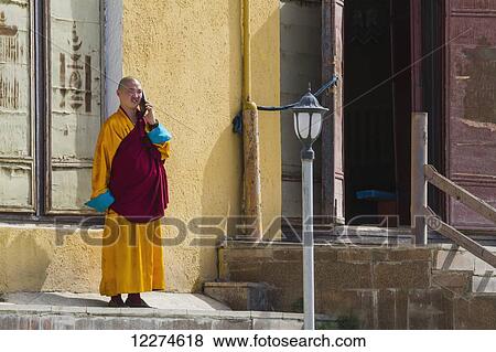 Stock Photo - Buddhist monk on a mobile telephone at Gandan Monastery (Gandantegchinlen Khiid), Ulaanbaatar (Ulan Bator), Mongolia. Fotosearch