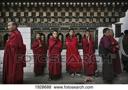 Buddhist Monks By Prayer Wheels View Large Photo Image Stock Photo - Buddhist Monks By Prayer Wheels. Fotosearch
