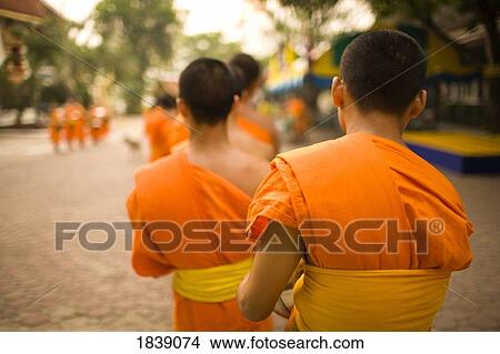 Buddhist Monks Collecting Food And Special Sonkran Blessing, Wat Srisoda, Buddhist Temple And Monastery; Chiang Mai, Thailand View Large Photo Image Picture - Buddhist Monks Collecting Food And Special Sonkran Blessing, Wat Srisoda, Buddhist Temple And Monastery; Chiang Mai, Thailand. Fotosearch