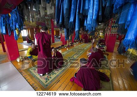 Stock Photo - Buddhist monks in the Tashchoimphel Temple at the Gandan Monastery (Gandantegchinlen Khiid), Ulaanbaatar (Ulan Bator), Mongolia. Fotosearch