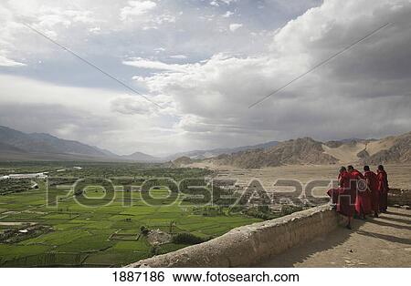 Buddhist Monks On Rooftop At Thikse Monastery Looking Over Indus Valley View Large Photo Image Stock Photograph - Buddhist Monks On Rooftop At Thikse Monastery Looking Over Indus Valley. Fotosearch