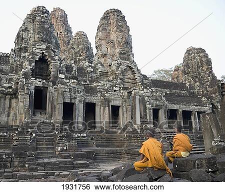 Buddhist Monks Sitting In Front Of Bayon Temple, Angkor Wat View Large Photo Image Stock Photograph - Buddhist Monks Sitting In Front Of Bayon Temple, Angkor Wat. Fotosearch