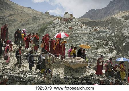 Stock Photo - Buddhist Monks Walking Down Mountain, Diskyid Monastery In Background, Nubra Valley, Leh Ladakh, India. Fotosearch