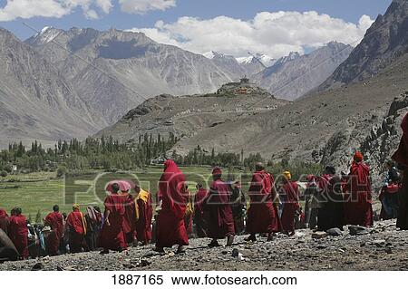 Buddhist Monks Walking In A Crowd With Snow Capped Peaks View Large Photo Image Stock Photography - Buddhist Monks Walking In A Crowd With Snow Capped Peaks. Fotosearch
