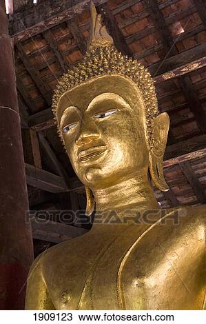 Stock Image - Buddhist Statue In Luang Prabang, Laos. Fotosearch
