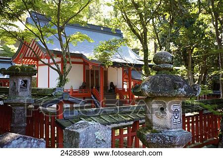 Stock Photo - Buddhist structures in front of a building; Japan. Fotosearch
