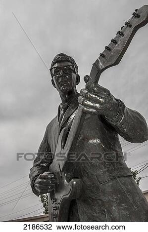 Stock Image - Buddy Holly Bronze Statue Outside The Buddy Holly Center, Lubbock, Texas, Usa. Fotosearch