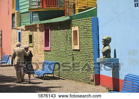 Buenos Aires, Argentina; A Couple Walking Through Caminito, A Pedestrian Walkway And Popular Tourist Stop In La Boca View Large Photo Image Stock Image - Buenos Aires, Argentina; A Couple Walking Through Caminito, A Pedestrian Walkway And Popular Tourist Stop In La Boca. Fotosearch