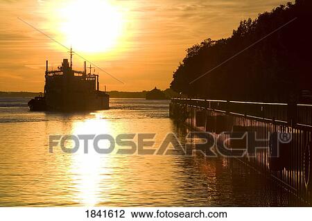 Buffalo Lighthouse And Cement Carrier In Buffalo Port At Sunset; Buffalo, New York State, Usa View Large Photo Image Stock Image - Buffalo Lighthouse And Cement Carrier In Buffalo Port At Sunset; Buffalo, New York State, Usa. Fotosearch