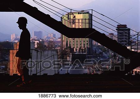 Stock Image - Builder On Construction Site. Fotosearch