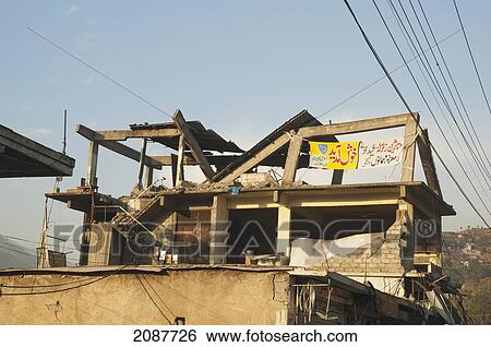 Stock Photograph - Building Destroyed By The 8 October 2005 Earthquake, Muzaffarabad, Azad Kashmir, Pakistan. Fotosearch
