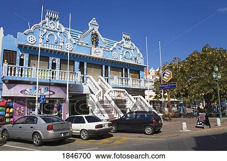 Building Exterior With Cars Parked Outside; Holland Aruba Mall. Oranjestad. Aruba Island. Kingdom Of The Netherlands. View Large Photo Image Stock Image - Building Exterior With Cars Parked Outside; Holland Aruba Mall. Oranjestad. Aruba Island. Kingdom Of The Netherlands.. Fotosearch