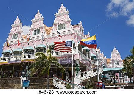 Building Exterior With Flags Waving Outside; Royal Plaza Mall, Oranjestad, Aruba Island, Kingdom Of The Netherlands. View Large Photo Image Stock Image - Building Exterior With Flags Waving Outside; Royal Plaza Mall, Oranjestad, Aruba Island, Kingdom Of The Netherlands.. Fotosearch