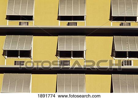 Picture - Building Exterior With Window Shutters. Fotosearch