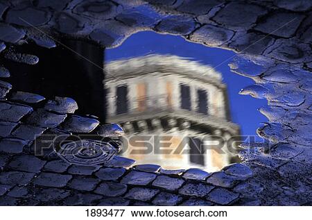 Building Top Reflecting In Pool Of Water On Paved Street View Large Photo Image Stock Photo - Building Top Reflecting In Pool Of Water On Paved Street. Fotosearch