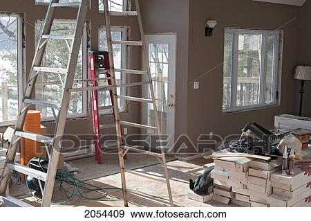 Stock Photo - Building Undergoing A Home Renovation With Tools And Material Placed In A Large Room, Ontario. Fotosearch