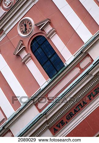 Stock Photo - Building With A Red And White Facade And A Clock. Fotosearch