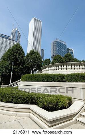 Buildings Against A Blue Sky And A Landscaped Area With Shrubs Trees And Railings; Chicago Illinois United States Of America View Large Photo Image Stock Image - Buildings Against A Blue Sky And A Landscaped Area With Shrubs Trees And Railings; Chicago Illinois United States Of America. Fotosearch