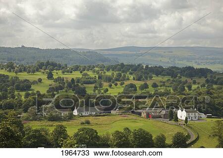 Buildings Along A Road With A Rolling Landscape In The Background; Stirling Scotland View Large Photo Image Stock Image - Buildings Along A Road With A Rolling Landscape In The Background; Stirling Scotland. Fotosearch
