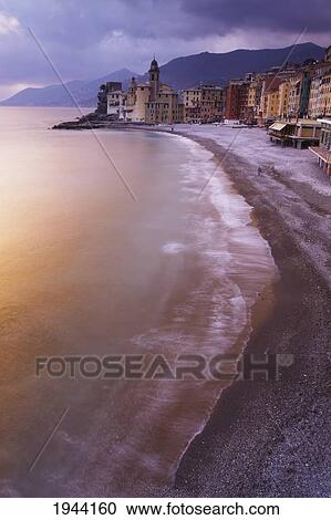 Stock Image - Buildings Along The Coast At Sunset; Camogli Liguria Italy. Fotosearch