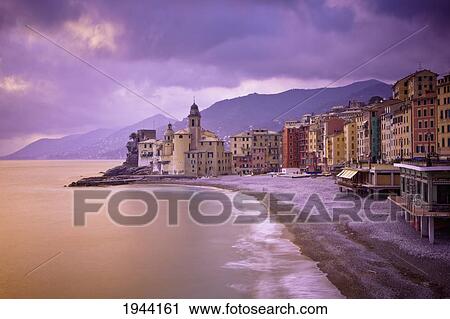 Stock Image - Buildings Along The Coast At Sunset; Camogli Liguria Italy. Fotosearch