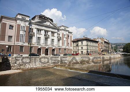 Buildings Along The Miljacka River, Sarajevo, Bosnia And Herzegovina View Large Photo Image Picture - Buildings Along The Miljacka River, Sarajevo, Bosnia And Herzegovina. Fotosearch