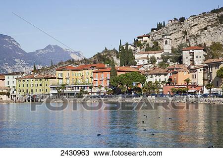 Buildings along the shoreline of Lake Garda; Malcesine, Verona, Italy View Large Photo Image Stock Image - Buildings along the shoreline of Lake Garda; Malcesine, Verona, Italy. Fotosearch