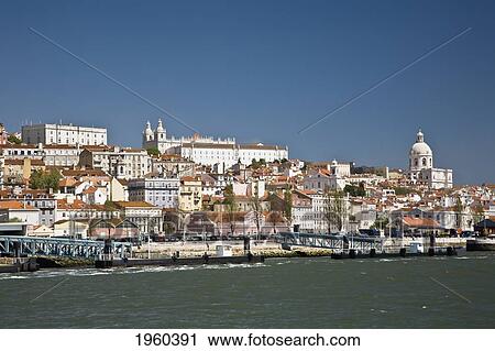 Stock Image - Buildings Along The Tagras River; Lisbon, Portugal. Fotosearch