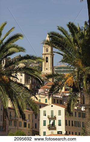Buildings And A Church Tower Against A Blue Sky With Palm Trees In The Foreground; Ventimiglia Italy View Large Photo Image Stock Image - Buildings And A Church Tower Against A Blue Sky With Palm Trees In The Foreground; Ventimiglia Italy. Fotosearch
