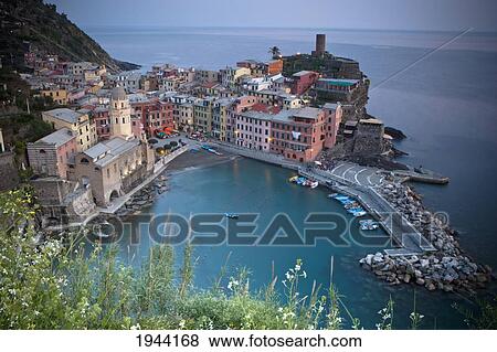 Buildings And A Harbor Along The Coast; Vernazza Liguria Italy View Large Photo Image Stock Photo - Buildings And A Harbor Along The Coast; Vernazza Liguria Italy. Fotosearch