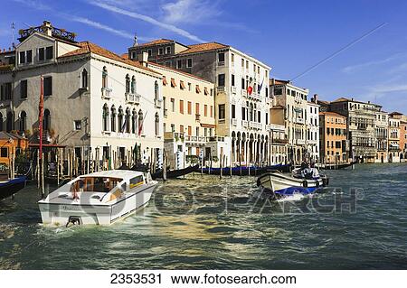 Stock Image - Buildings And Boats Along The Grand Canal; Venice, Italy. Fotosearch