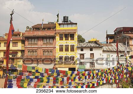 Buildings and prayer flags on the main square; Boudhanath, Nepal View Large Photo Image Picture - Buildings and prayer flags on the main square; Boudhanath, Nepal. Fotosearch