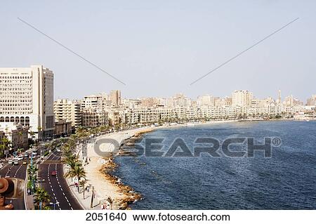 Stock Image - Buildings On The Corniche Along The Mediterranean Sea, Alexandria, Al Iskandar. Fotosearch