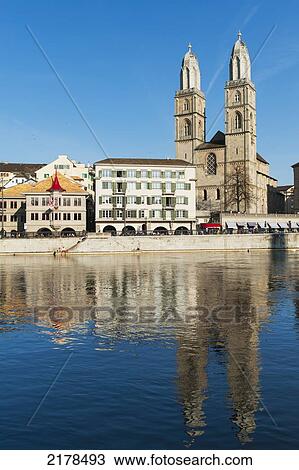 Stock Image - Buildings On The Water's Edge Reflected In The Water; Zurich Switzerland. Fotosearch