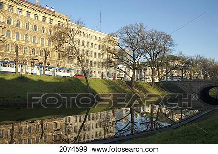 Stock Photo - Buildings Reflected In The Pilsetas Canal, Riga, Latvia. Fotosearch
