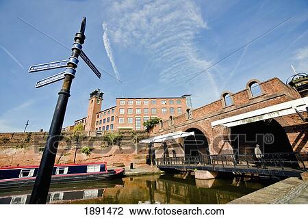Stock Image - Buildings Surrounding Basin And Canal In Castlefield. Fotosearch