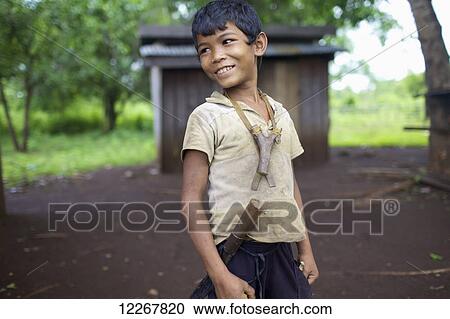 Bunong boy with slingshot; Mondulkiri, Cambodia View Large Photo Image Stock Image - Bunong boy with slingshot; Mondulkiri, Cambodia. Fotosearch
