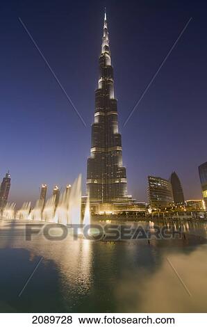 Burj Khalifa With Fountain At Dusk In Dubai, Uae View Large Photo Image Stock Photo - Burj Khalifa With Fountain At Dusk In Dubai, Uae. Fotosearch
