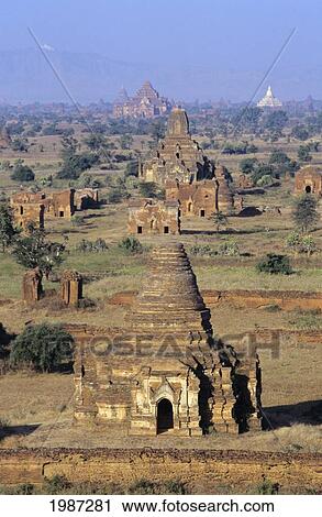 Stock Image - Burma (Myanmar), Bagan Overhead Landscape Of Temples And Stupas, Hazy Horizon In Distance.. Fotosearch