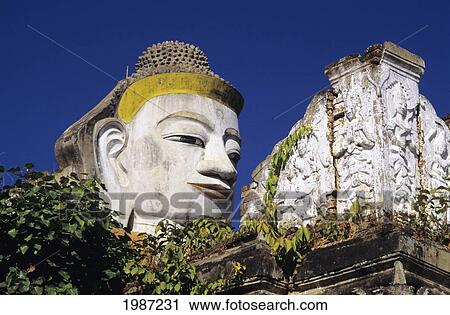 Stock Image - Burma (Myanmar), Close-up of colossal head of Buddha statue; Mandalay. Fotosearch
