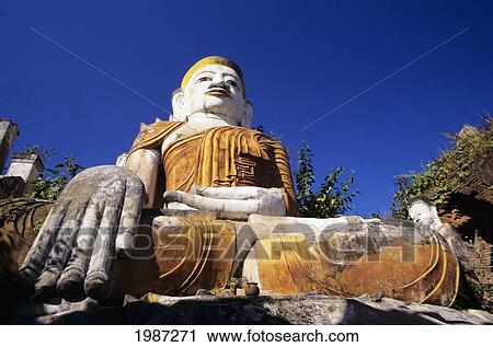 Stock Image - Burma (Myanmar), Inle Lake, Nanthe Village, Close-up of Buddha statue; Kyaukpygyi Paya. Fotosearch