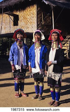 Burma (Myanmar), Kaungdine Village, Inle Lake, Three Padaung Tribal Women Standing In Front Of House, Colorful Clothing. Editorial Use Only. View Large Photo Image Stock Photography - Burma (Myanmar), Kaungdine Village, Inle Lake, Three Padaung Tribal Women Standing In Front Of House, Colorful Clothing. Editorial Use Only.. Fotosearch