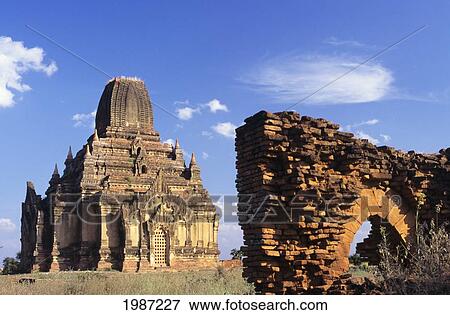 Burma (Myanmar), Old Tayokpye temple and wall in foreground; Bagan View Large Photo Image Stock Photo - Burma (Myanmar), Old Tayokpye temple and wall in foreground; Bagan. Fotosearch