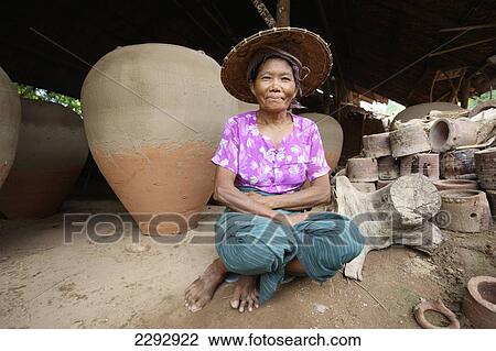 Burma/ Myanmar, Portrait of woman with pottery in background; Nwe Nyein View Large Photo Image Stock Image - Burma/ Myanmar, Portrait of woman with pottery in background; Nwe Nyein. Fotosearch