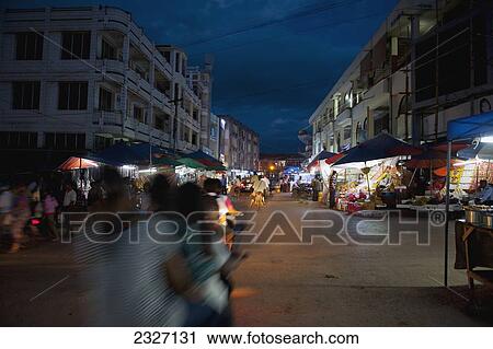Stock Image - Burma, Shan State, Busy street in city of Lashio at night; Lashio. Fotosearch